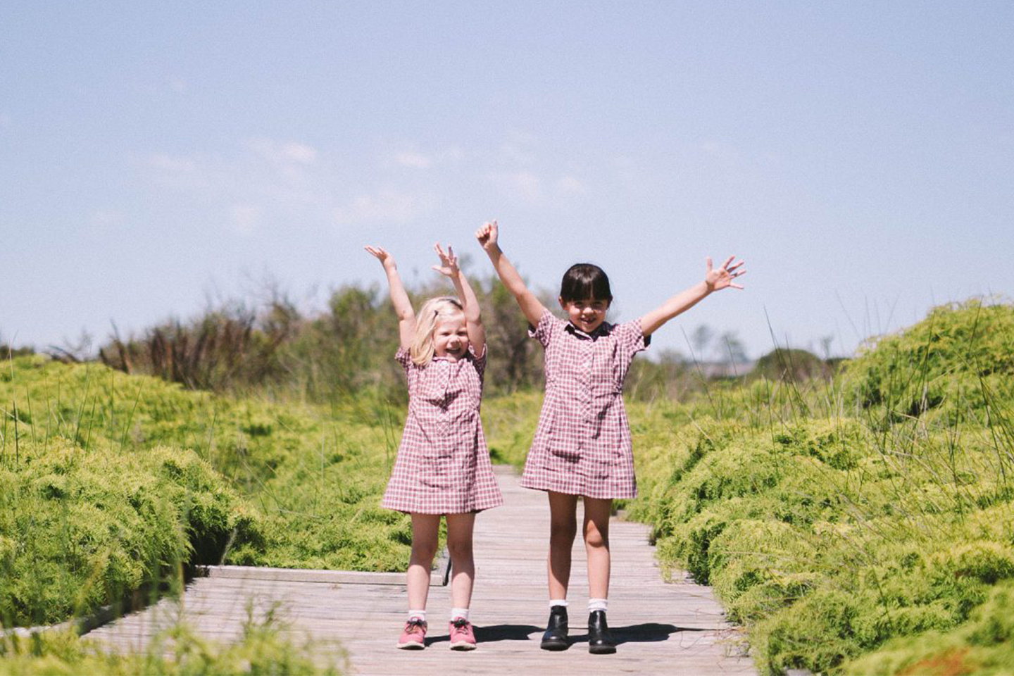 Photo of two young students standing on decking among the Mount Compass Area School swamp