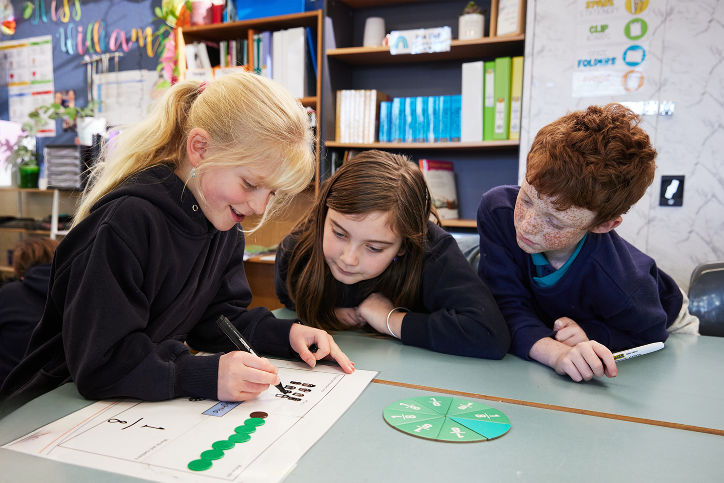 Photo of primary school students solving maths question