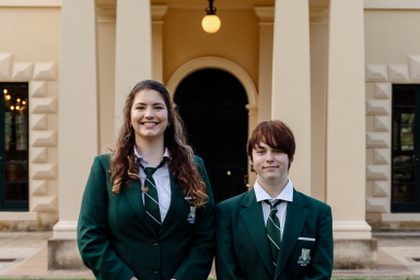 Two students standing in front of Government House